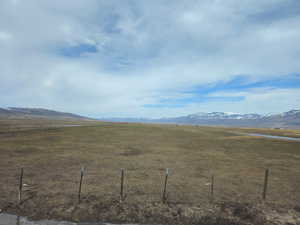 Property view of mountains with a rural view