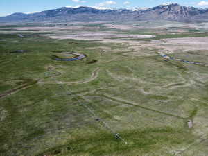Aerial view of property's location featuring mountains