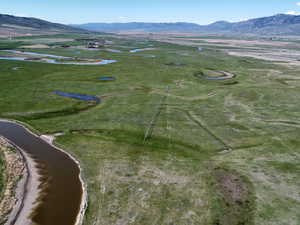 View of property location featuring a water and mountain view