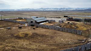 Birds eye view of property with a rural view and a mountain view