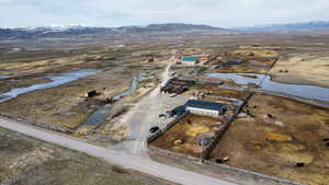 Aerial view featuring a rural view and a mountain view