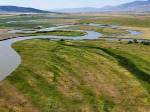 View of property location with a water and mountain view