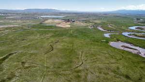 View of property location with a water and mountain view