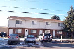 View of front of property with stucco siding and brick siding