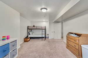 Carpeted bedroom with baseboards