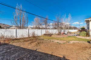 View of yard with a patio and a fenced backyard