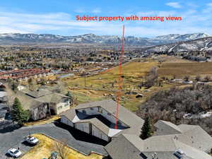 Birds eye view of property with a mountain view