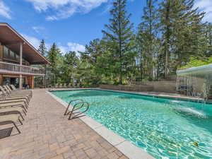 Community pool featuring a patio