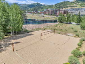 Surrounding community featuring volleyball court and a mountain view
