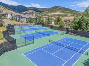 View of tennis court featuring a mountain view