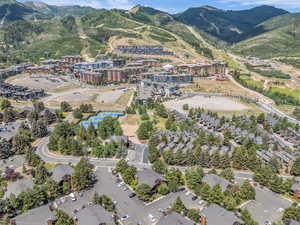Aerial view of property and surrounding area with mountains