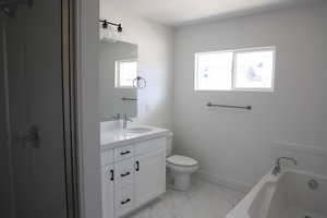 Full bathroom with toilet, marble finish floor, baseboards, a bath, and vanity