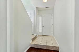 Entrance foyer with tile patterned floors