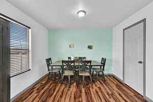 Dining space with dark floors