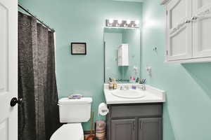 Bathroom featuring toilet and vanity