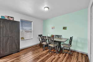 Dining space with dark floors