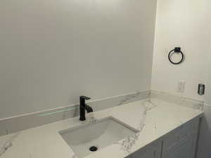Bathroom with marble finish floor and a sink