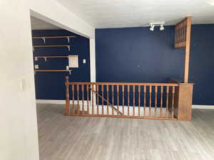 Interior space with wood finished floors and baseboards
