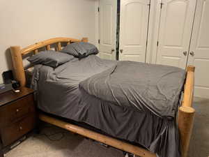 ADU Bedroom with light colored carpet and a closet