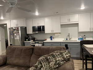 ADU Kitchen with visible vents, gray cabinetry, a sink, appliances with stainless steel finishes, and ceiling fan