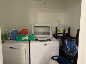 ADU Clothes washing area with washing machine and clothes dryer and laundry area