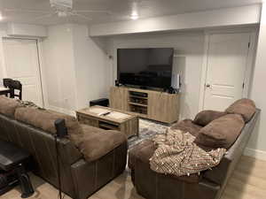 ADU Living area with light wood-style flooring, baseboards, and a ceiling fan