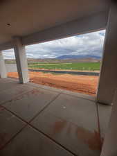 View of patio / terrace featuring a mountain view and a view of countryside