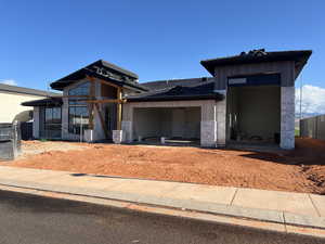 View of front of home featuring an attached garage