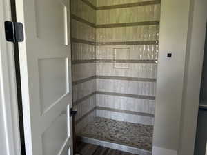 Full bathroom with a shower stall