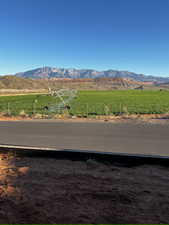 View of mountain backdrop featuring rural landscape