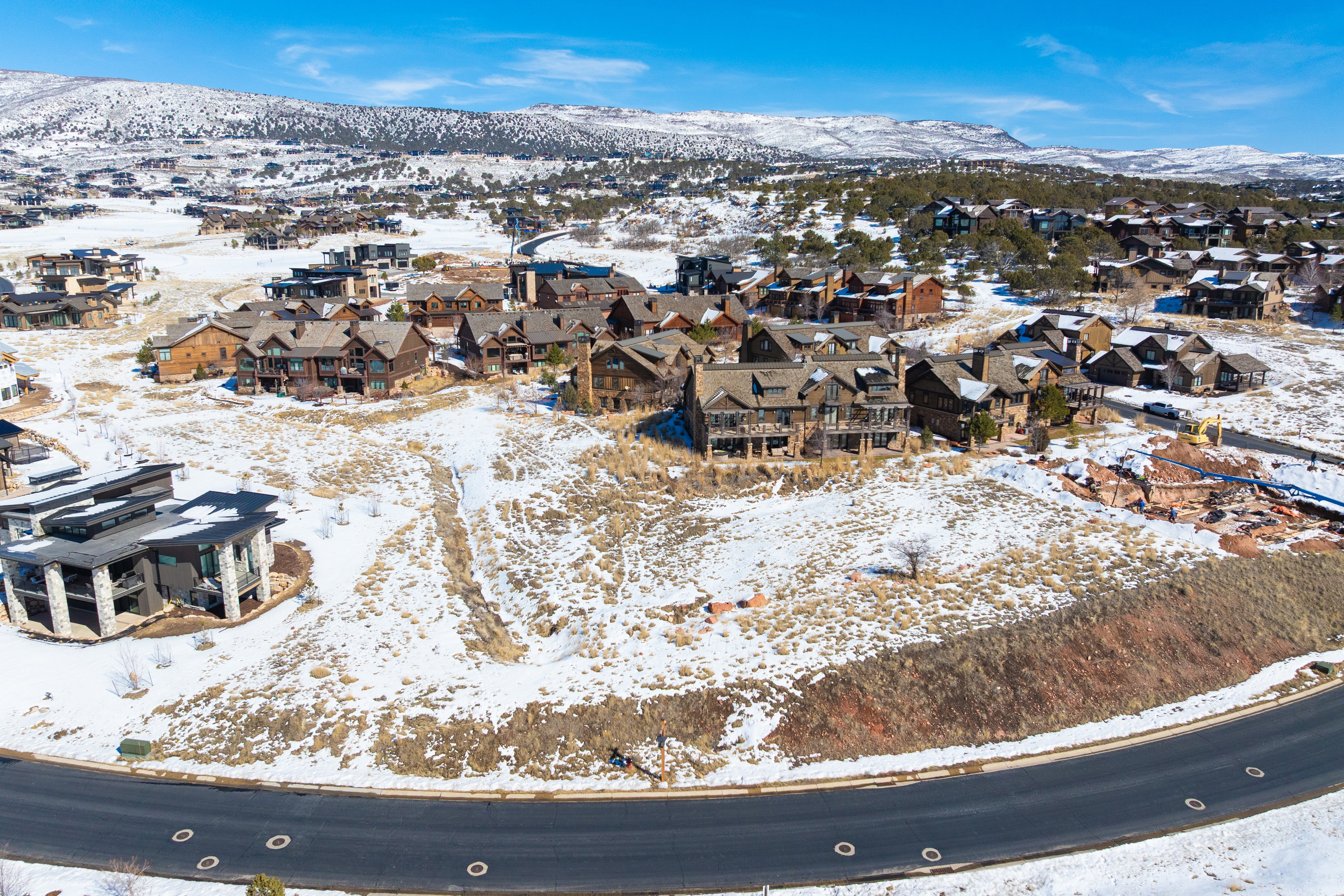 Snowy aerial view with a residential view and a mountain view