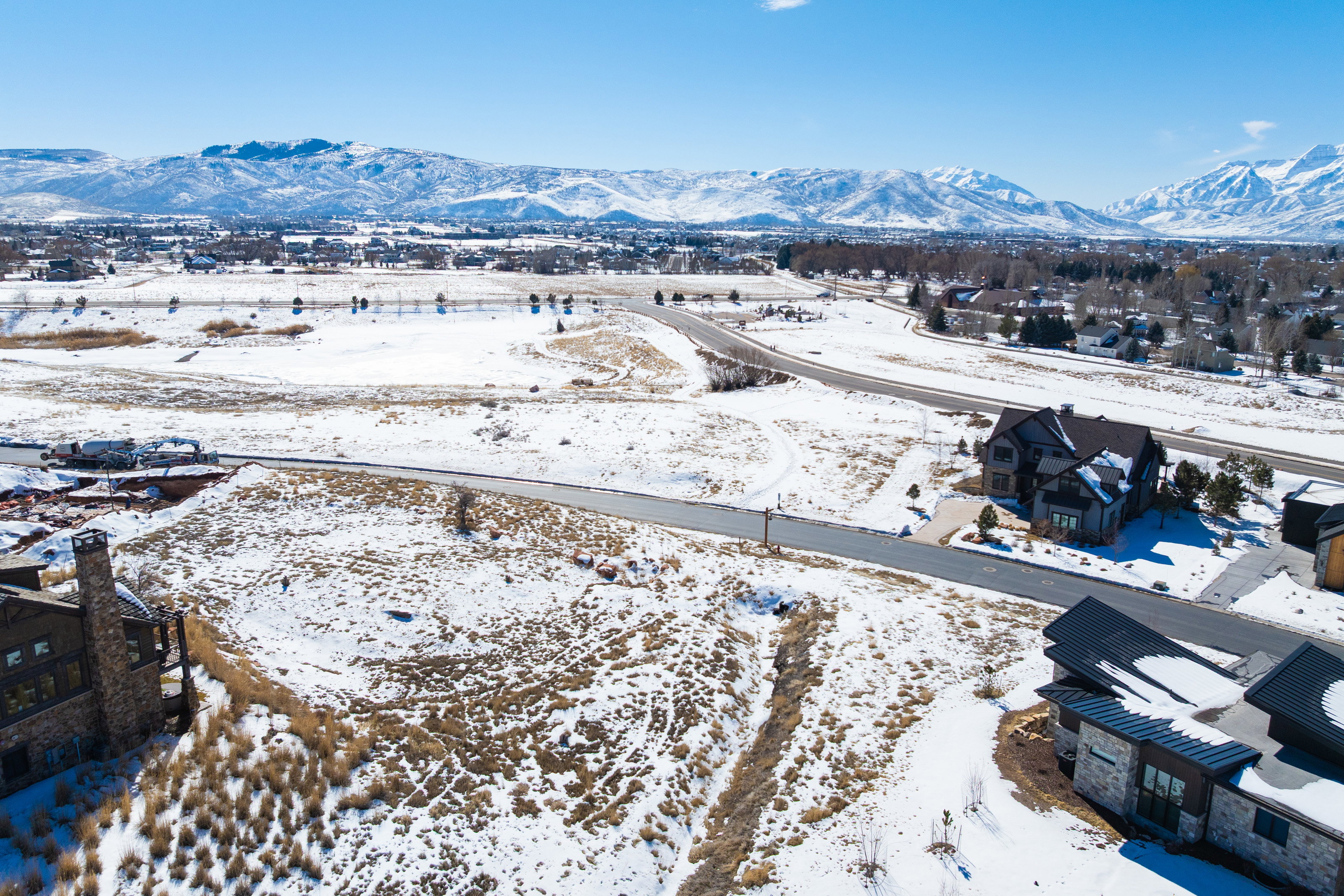 View of mountain backdrop featuring nearby suburban area