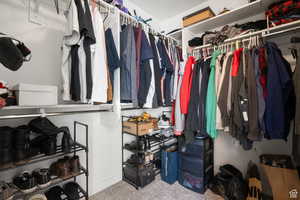 Spacious closet featuring carpet floors