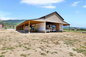 View of outbuilding featuring a mountain view