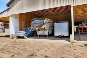 View of vehicle parking with a carport