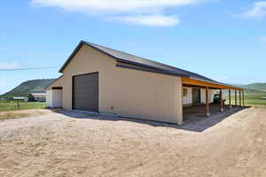 Detached garage with a mountain view