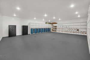 Garage with baseboards and recessed lighting