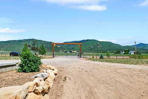 View of mountain background featuring rural landscape