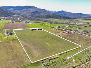 View of rural area with property parcel outlined and a mountainous background