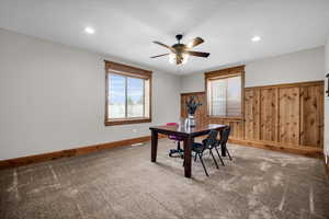 Home office featuring carpet, a ceiling fan, plenty of natural light, and recessed lighting