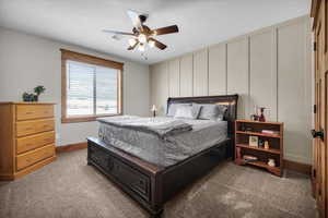 Bedroom with light colored carpet and ceiling fan