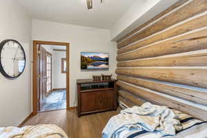 Bedroom with light wood-style flooring and a ceiling fan
