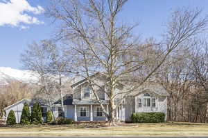 Traditional-style home with a front yard