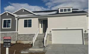 View of front of home with a garage, stone siding, and concrete driveway