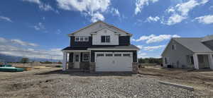 View of front of house with an attached garage, cooling unit, stone siding, and driveway