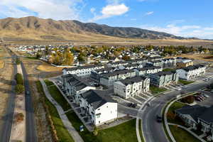 Aerial view featuring a mountain view and a residential view