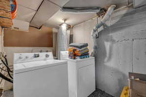 Laundry room featuring washing machine and dryer and laundry area