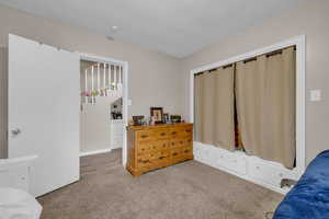 Bedroom featuring carpet flooring