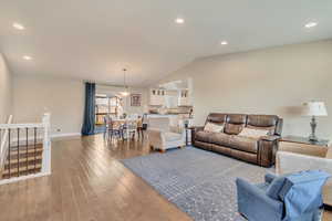 Living room featuring recessed lighting and  vaulted ceiling