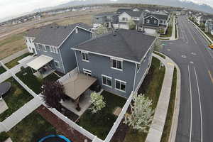 Birds eye view of property featuring a mountain view and a residential view